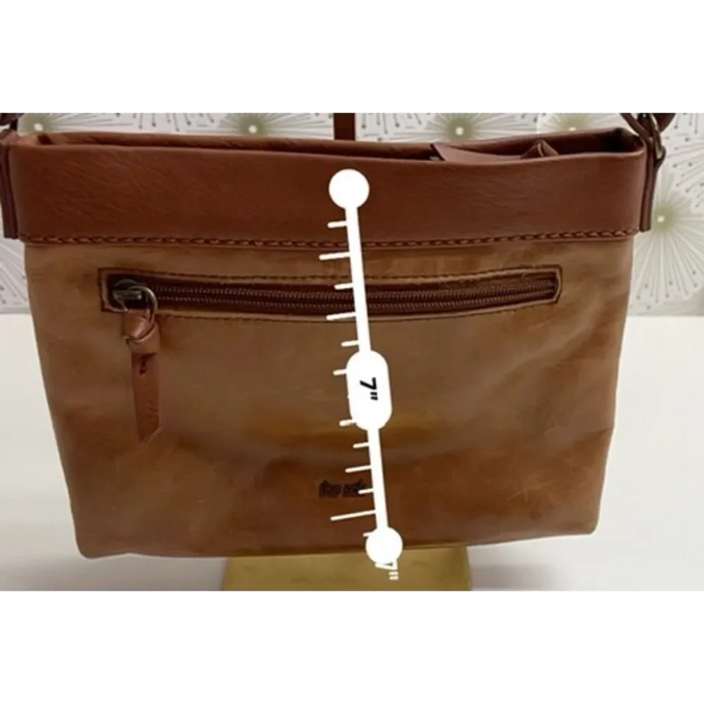 The Sak matte floral embossed tan leather Sanibel crossbody bag